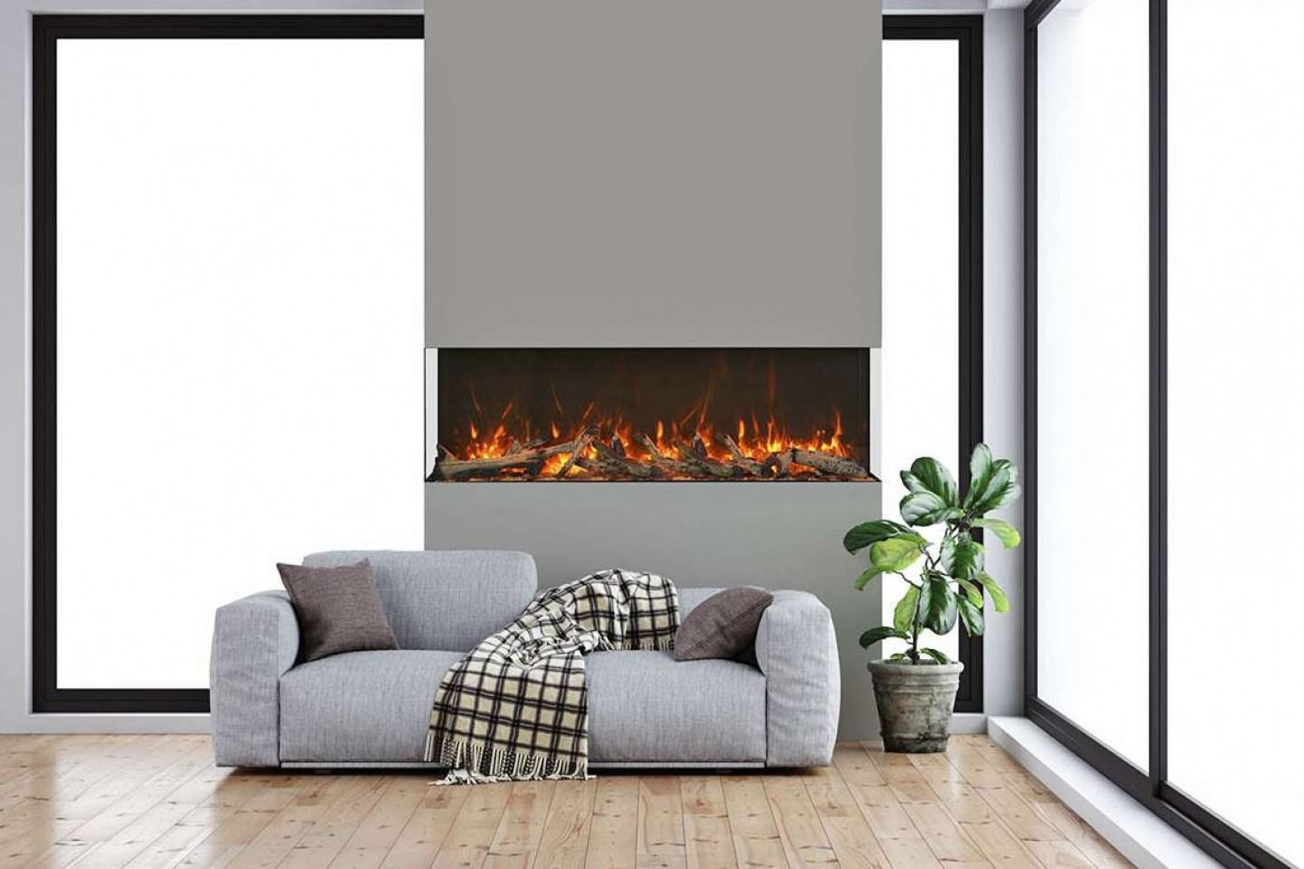 Modern living room with a gray sofa, fireplace, and large windows.