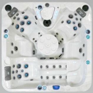 Overhead view of a white, multi-seat hot tub with numerous jets and controls.