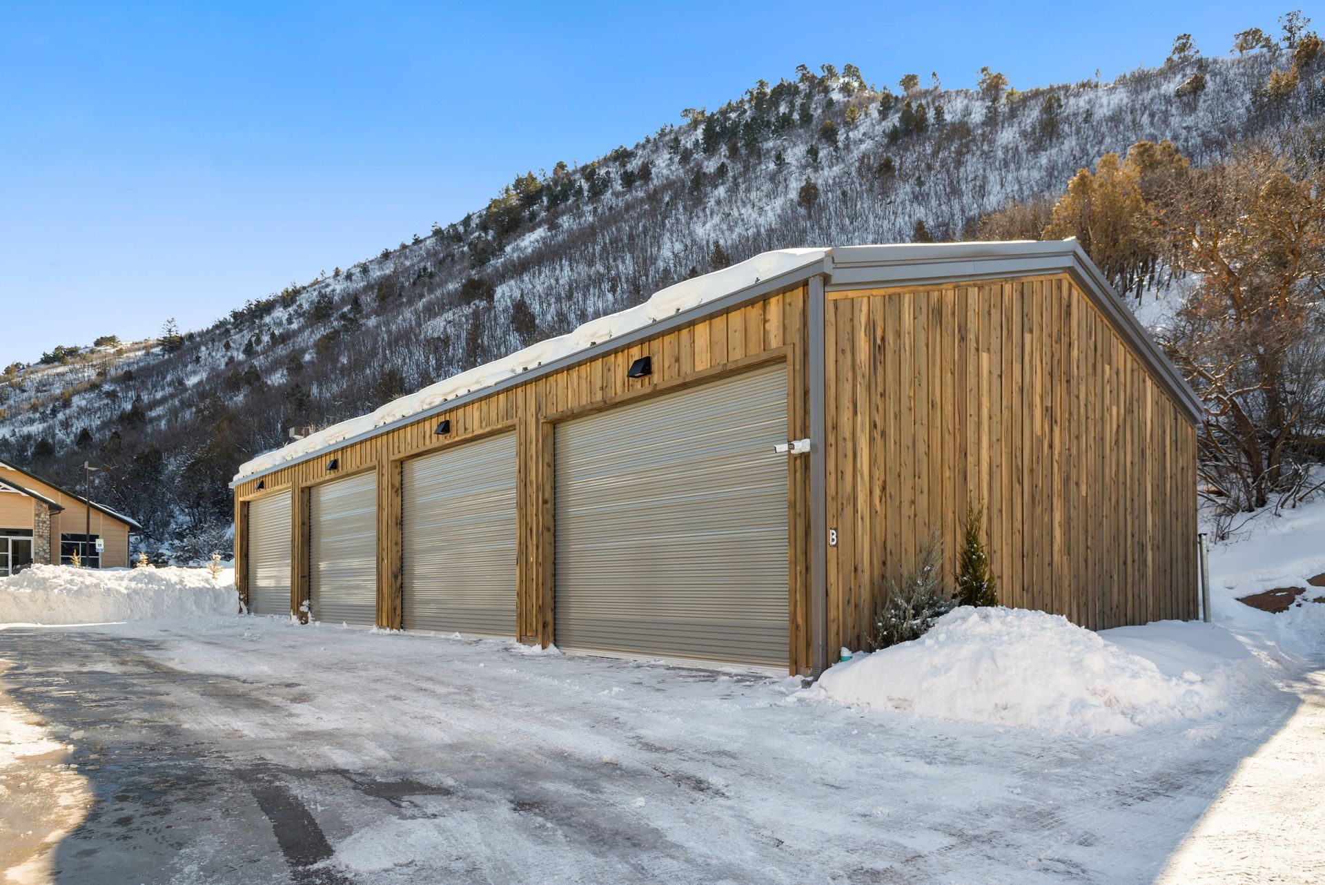 Snowmass Self Storage facility exterior with mountains in background
