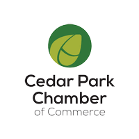 The cedar park chamber of commerce logo is a green leaf in a circle.