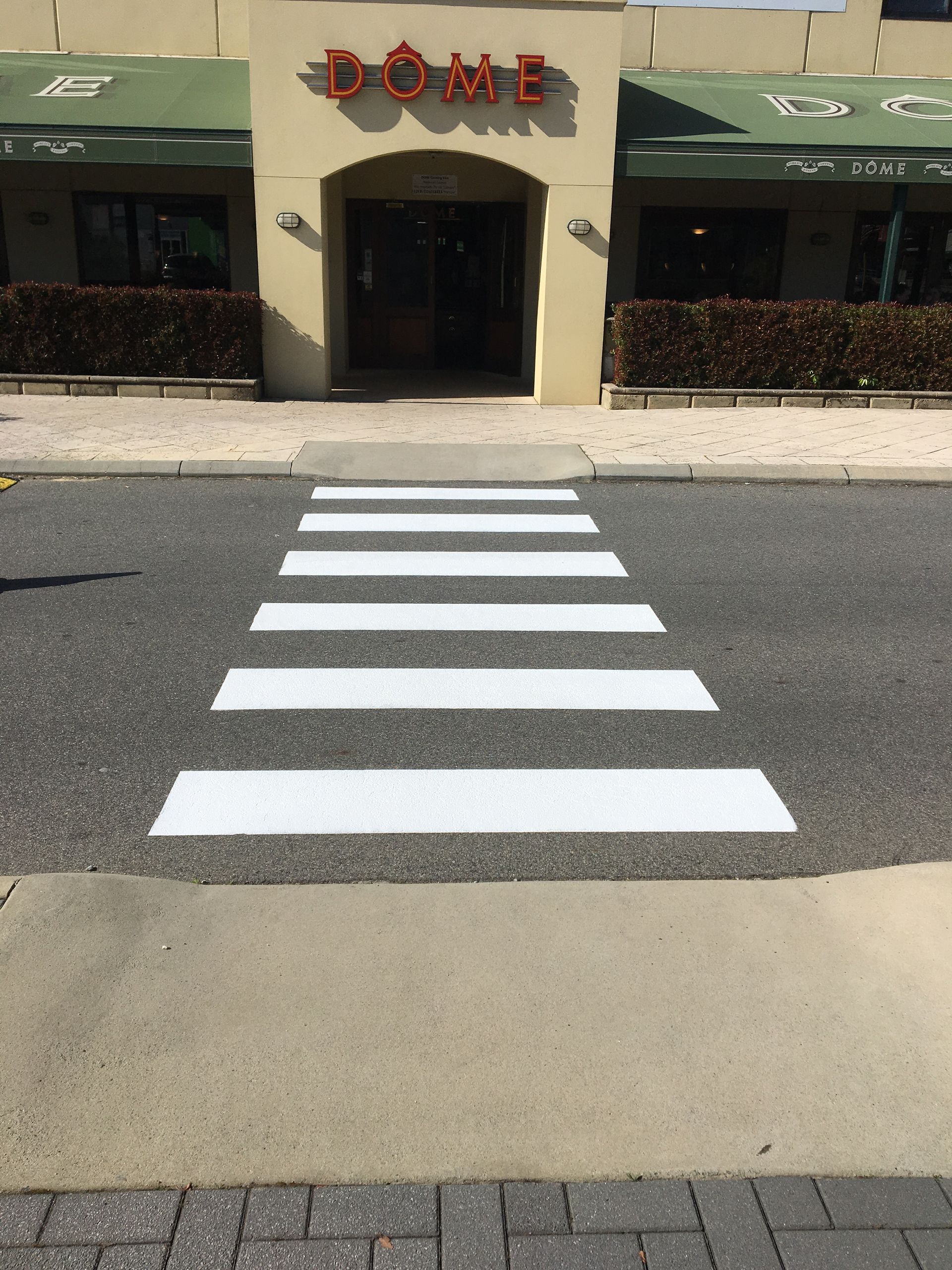 Crosswalk in front of a restaurant called 