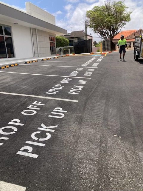 New asphalt parking lot with