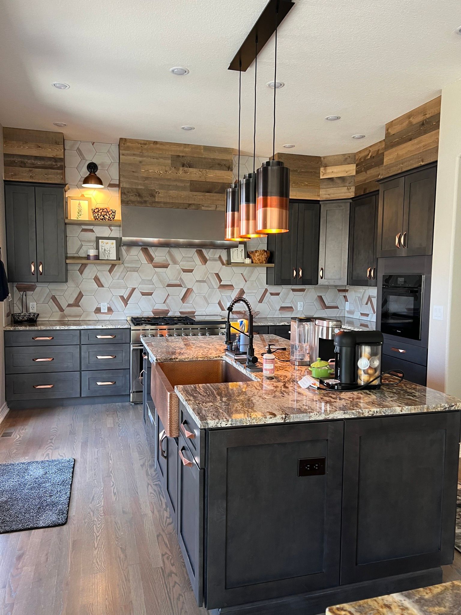 A kitchen with a large island in the middle of it.