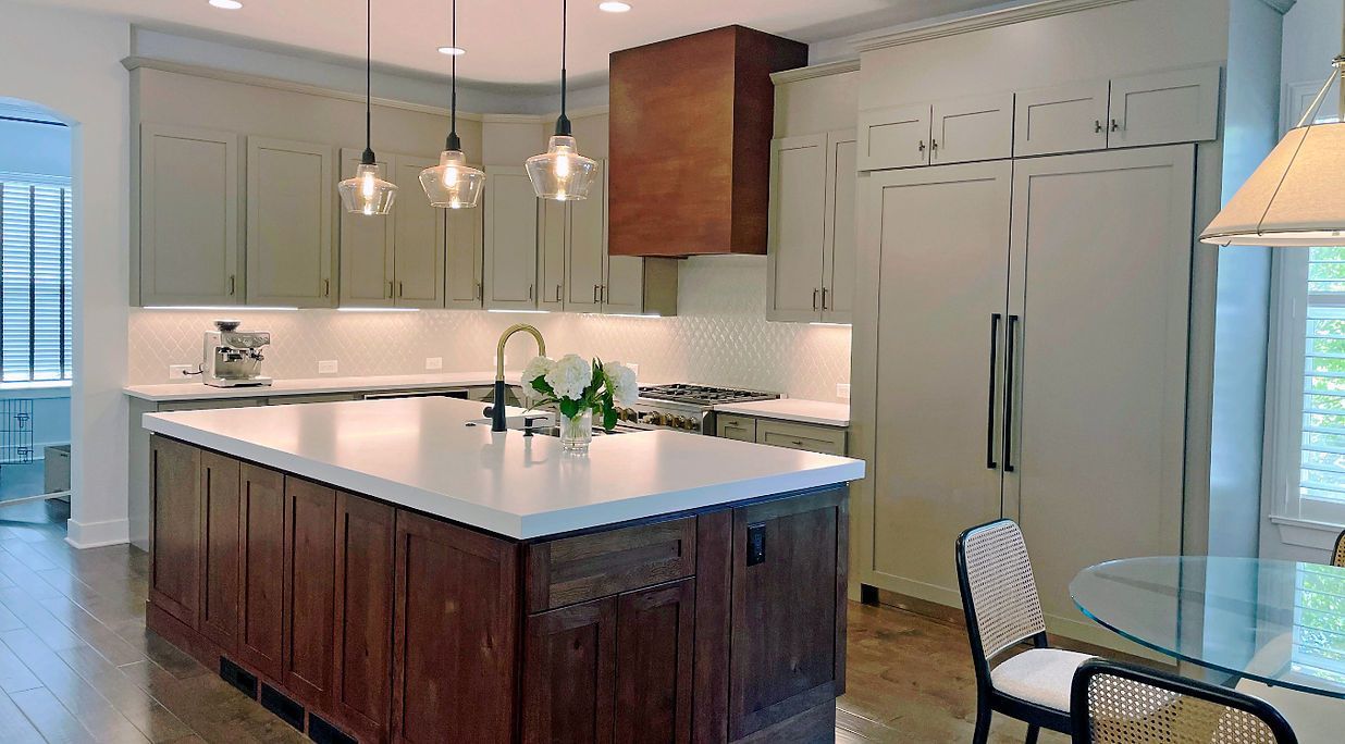 There is a large island in the middle of the kitchen.