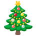 Albero di Natale decorato con ornamenti, puntale a stella e regali sottostanti.