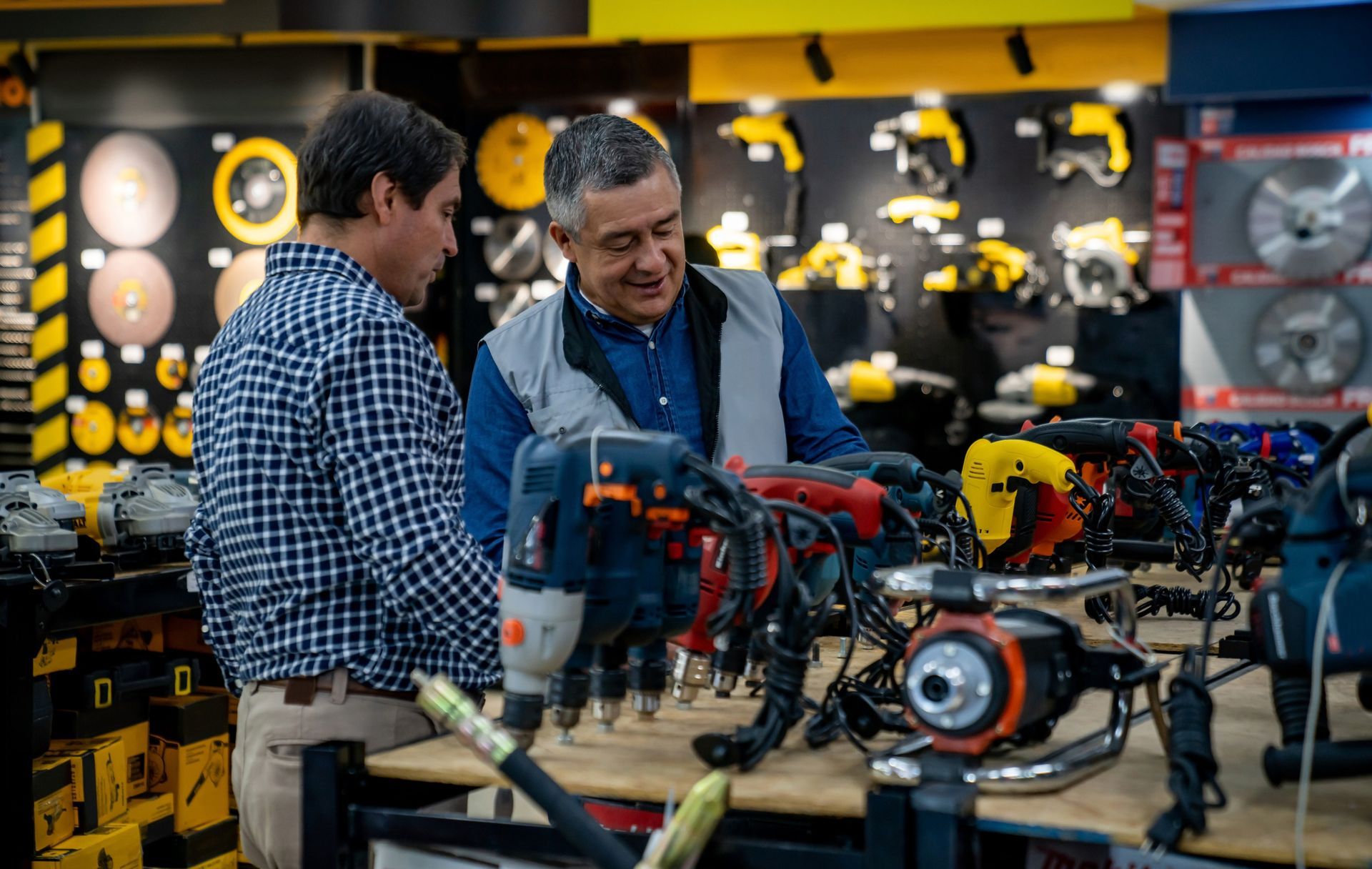 Professional plumber in a red uniform, performing hot water installation in a residential house.