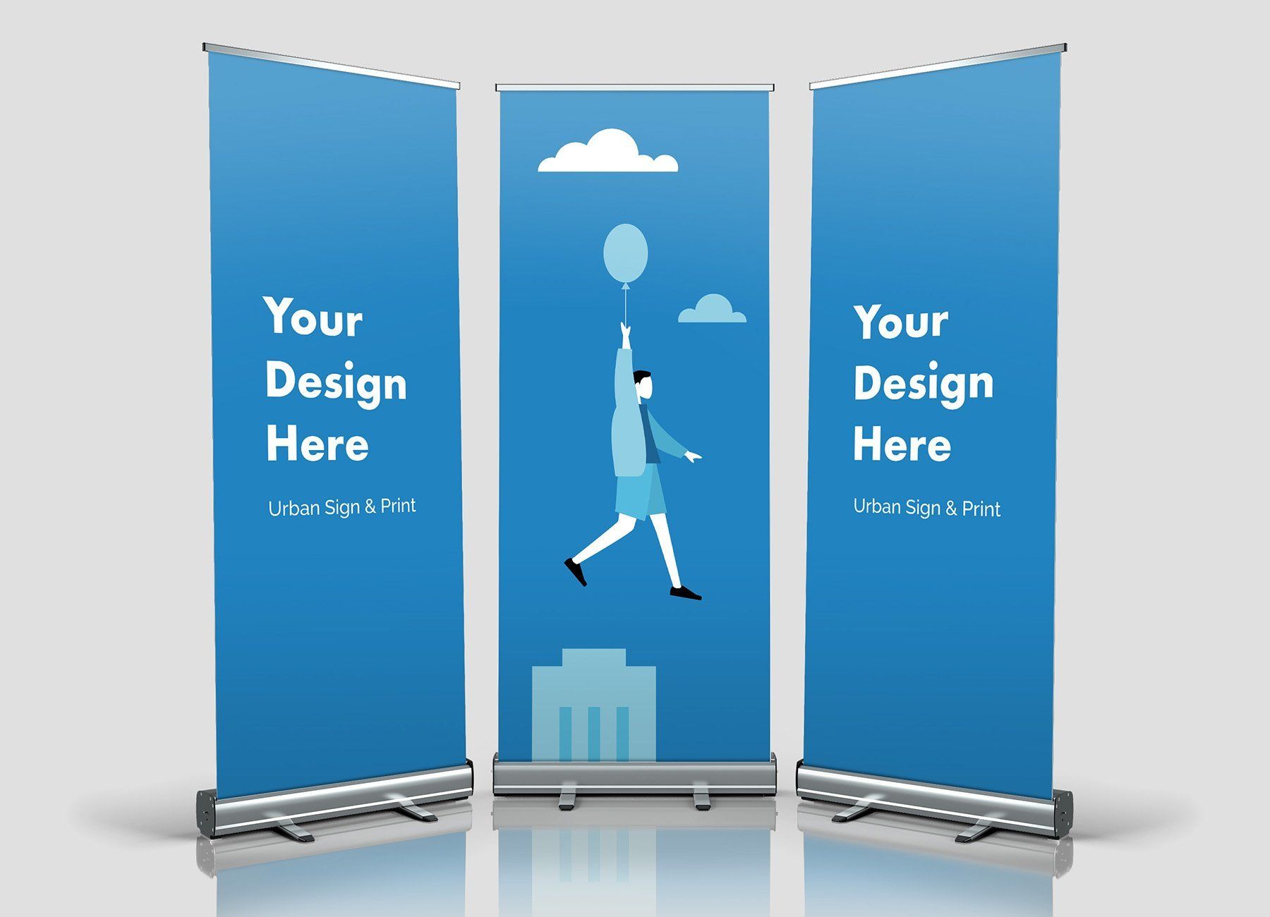 three blue roll up banners that say your design here