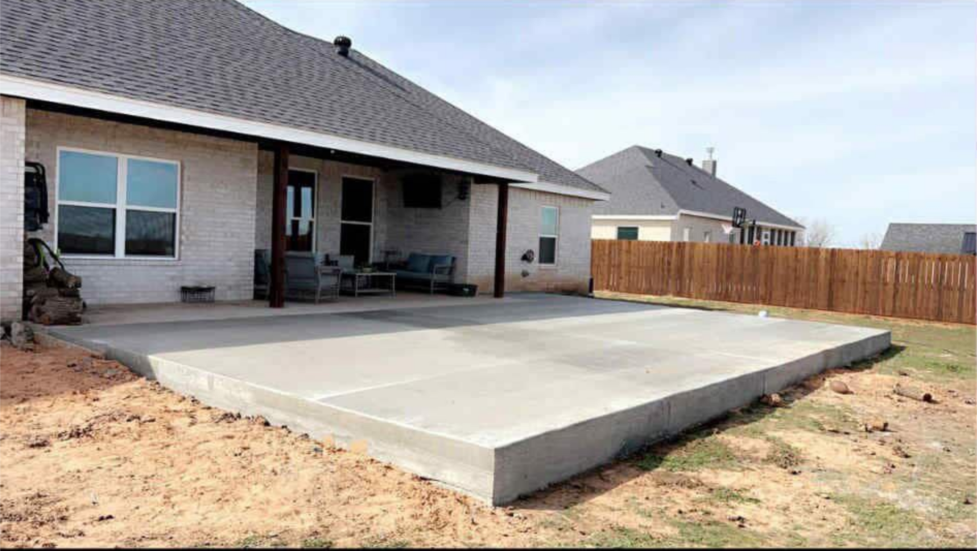 Person in suit pointing at paperwork with a pen. Close-up on the form on a wooden table.