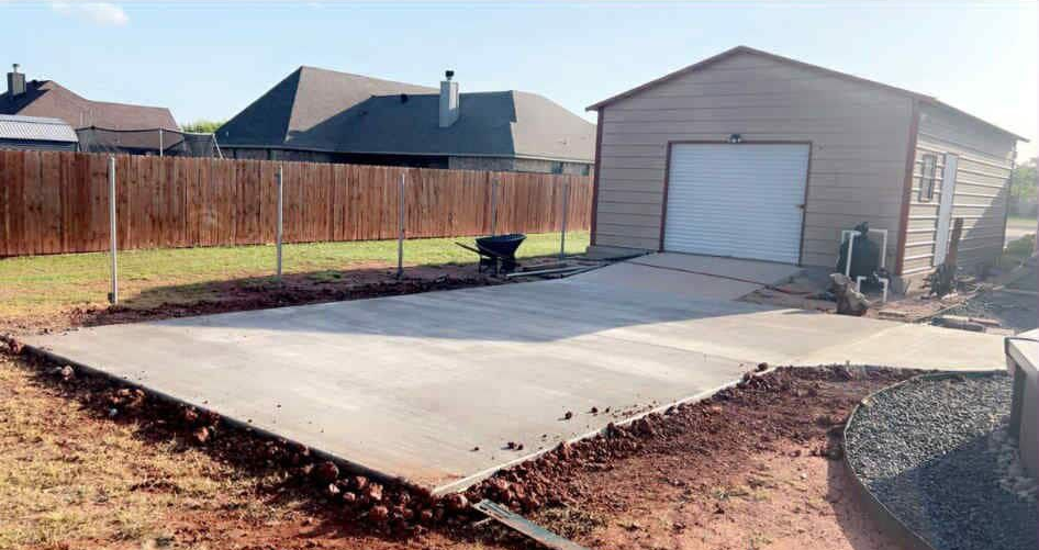 Tall, light-colored building between two modern buildings, viewed from a low angle. Sky visible at top.