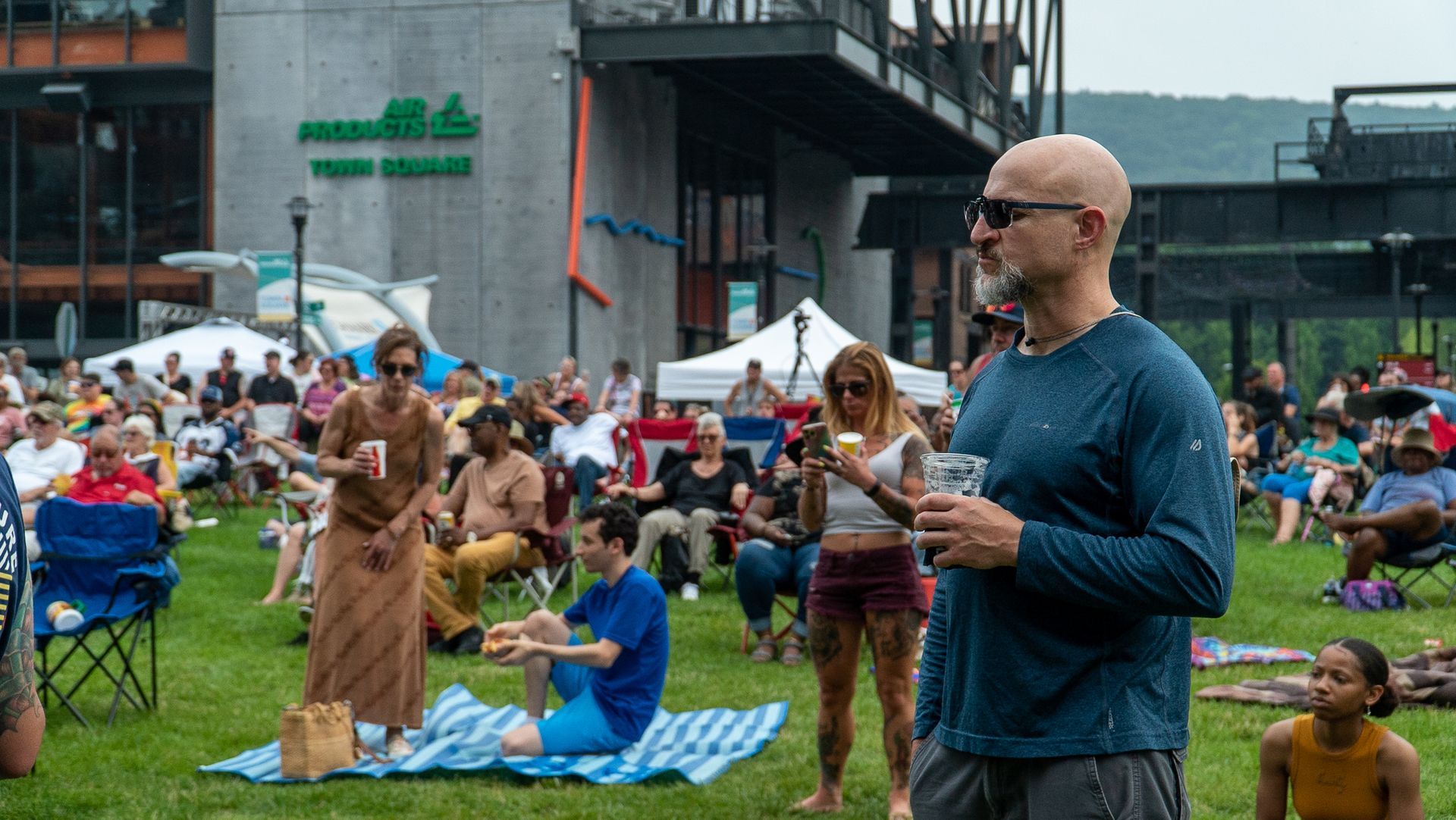 A man is standing in front of a crowd of people.