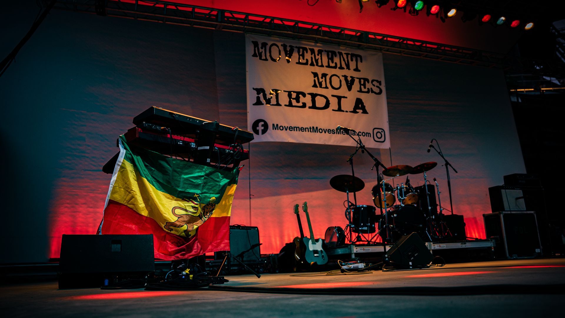 A stage with a sign that says movement moves media on it.
