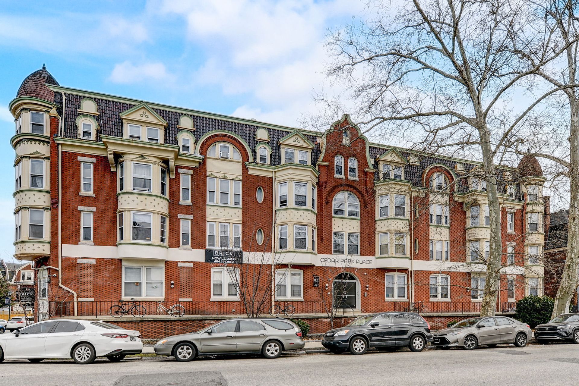 Photo of an older, large, multi-story building with a large amount of windows