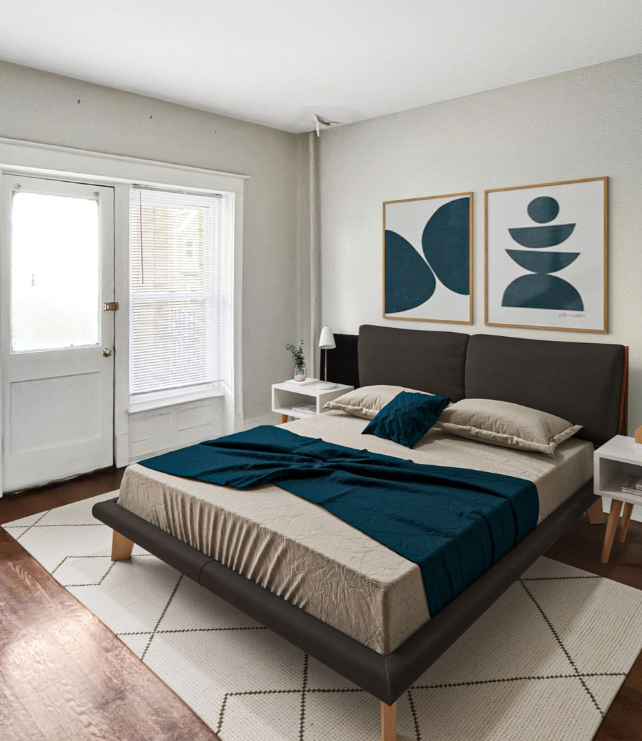 Photo of a large bedroom with plenty of natural lighting