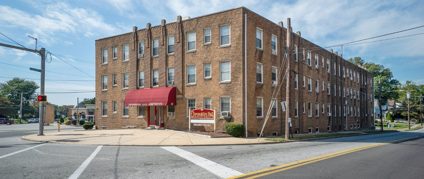Photo of a large building at a city corner