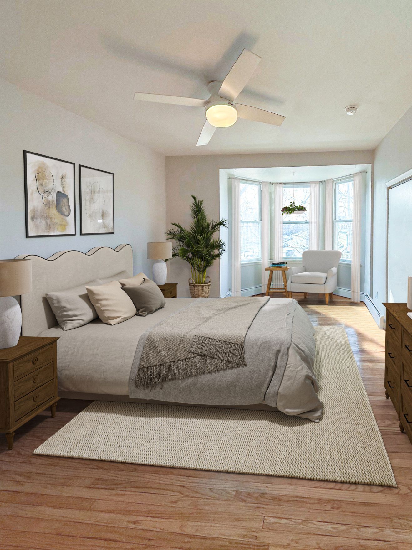 Photo of a room with plenty of natural lighting and a bay window and ceiling fan