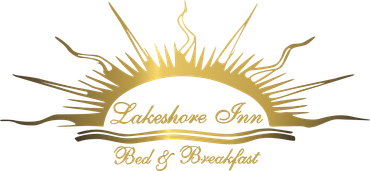 A gold logo for lakeshore inn bed and breakfast