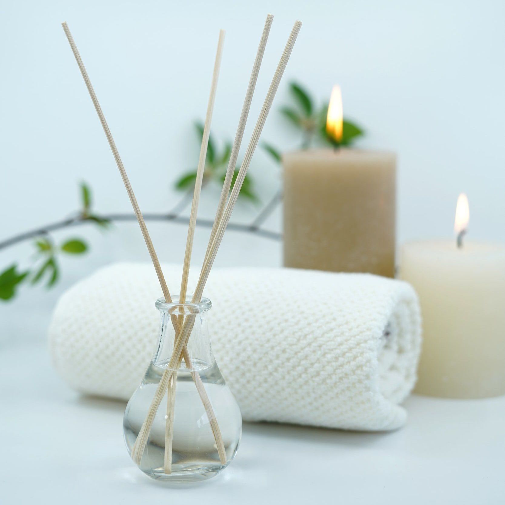 Spa towels and lit candles
