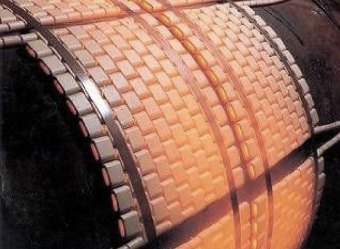 A close up of a brick wall with a brick pattern