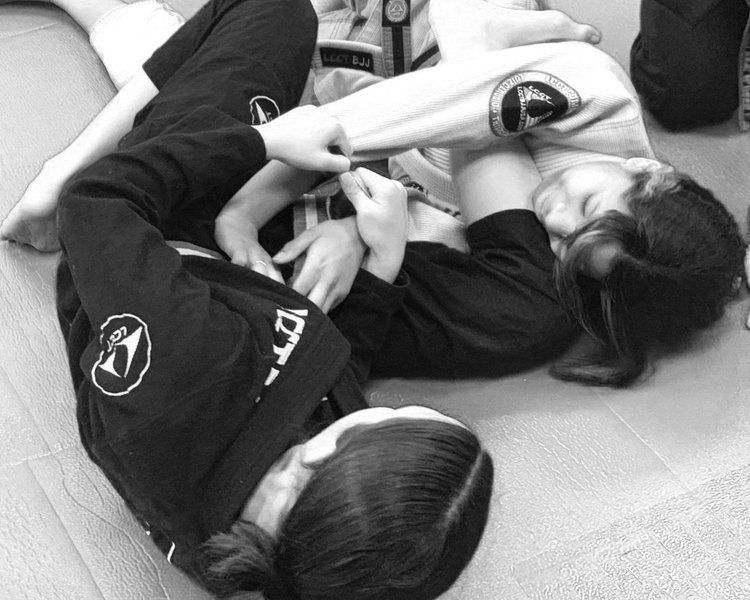 Two men are posing for a picture in front of a sign that says lg