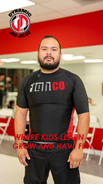 Two young boys wearing black karate uniforms with lcct bjj written on them
