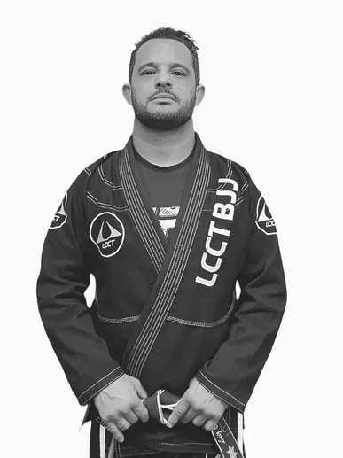 Two young boys wearing black karate uniforms with lcct bjj written on them