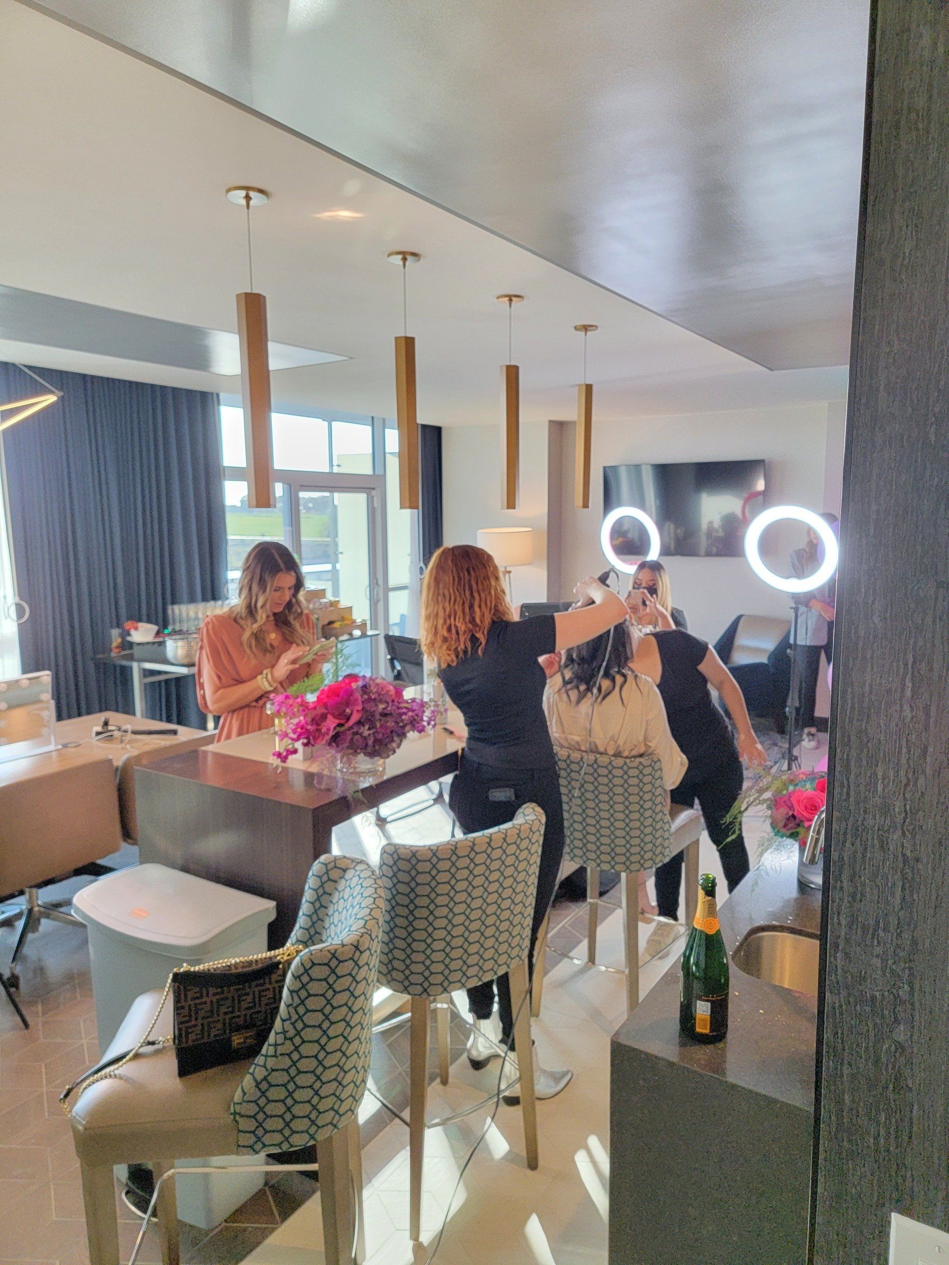 Influencers getting makeup and hair services done by mobile hairstylists and makeup artists