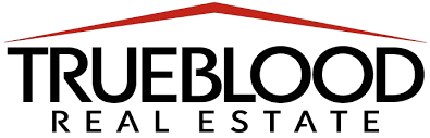 The logo for trueblood real estate is a house with a red roof.