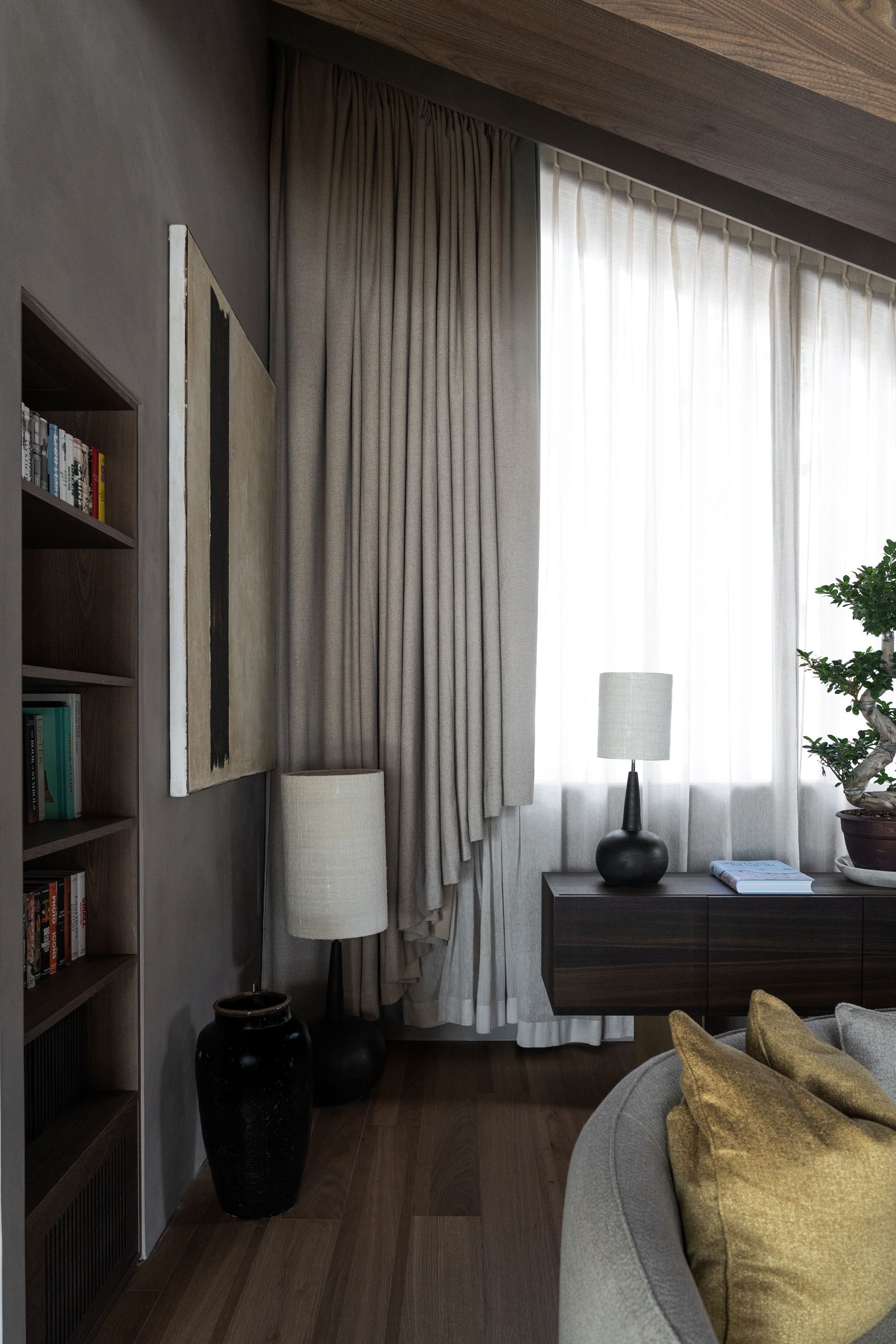 Chalet Escapade A living room with a couch and a lamp