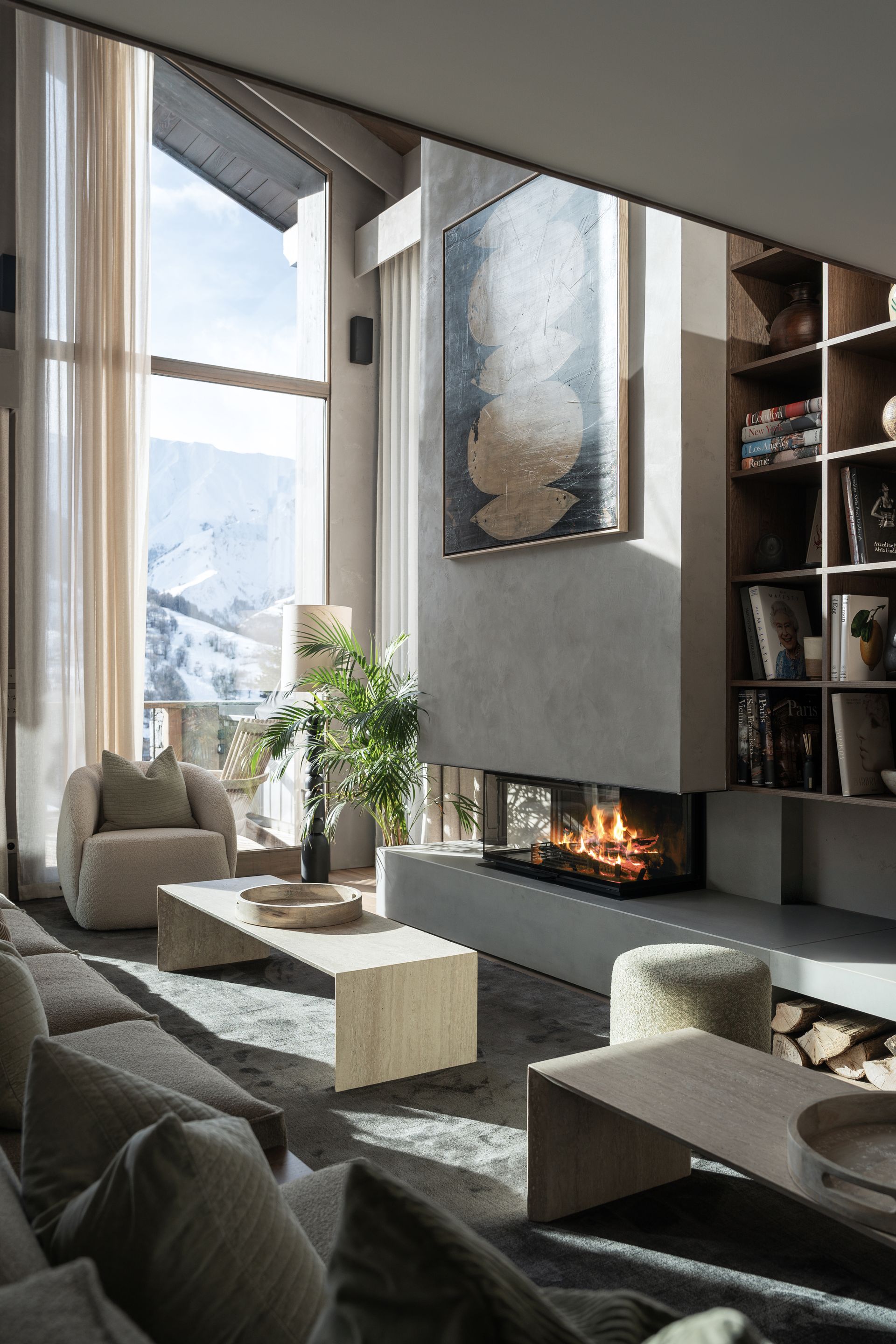 Chalet Escapade There is a fireplace in the middle of the living room.