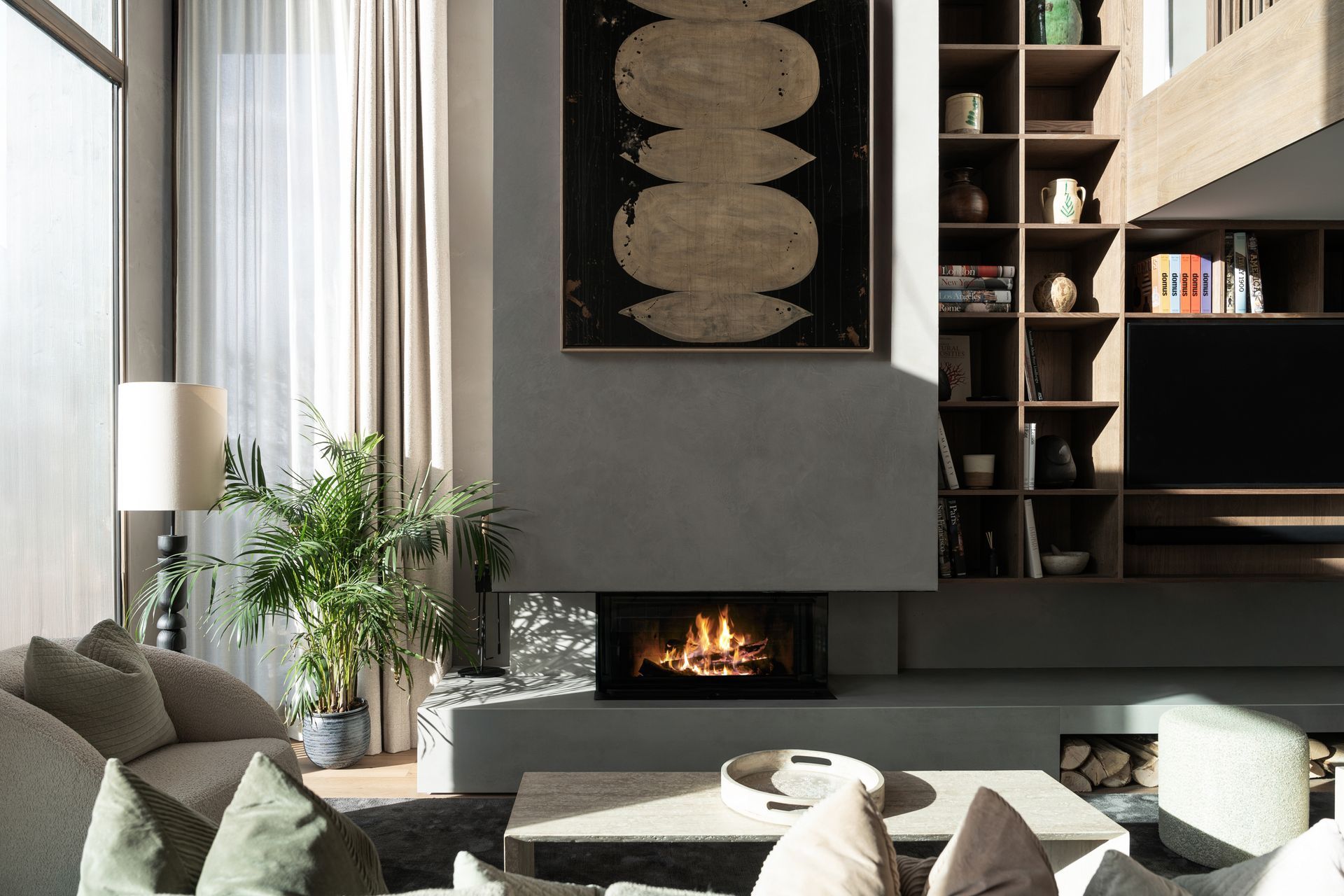 Chalet Escapade There is a fireplace in the middle of the living room.