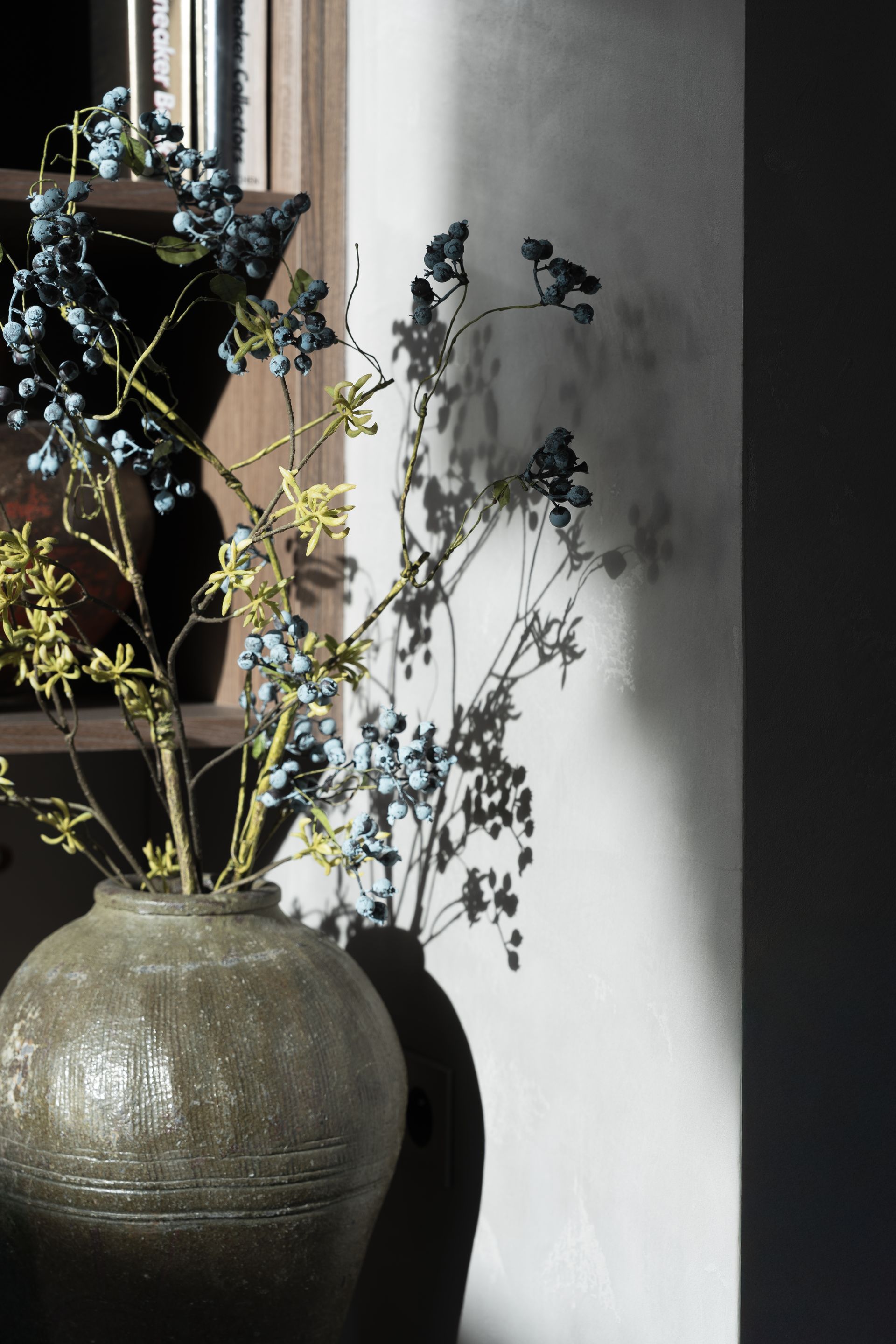 Chalet Escapade A vase filled with flowers sits in front of a window