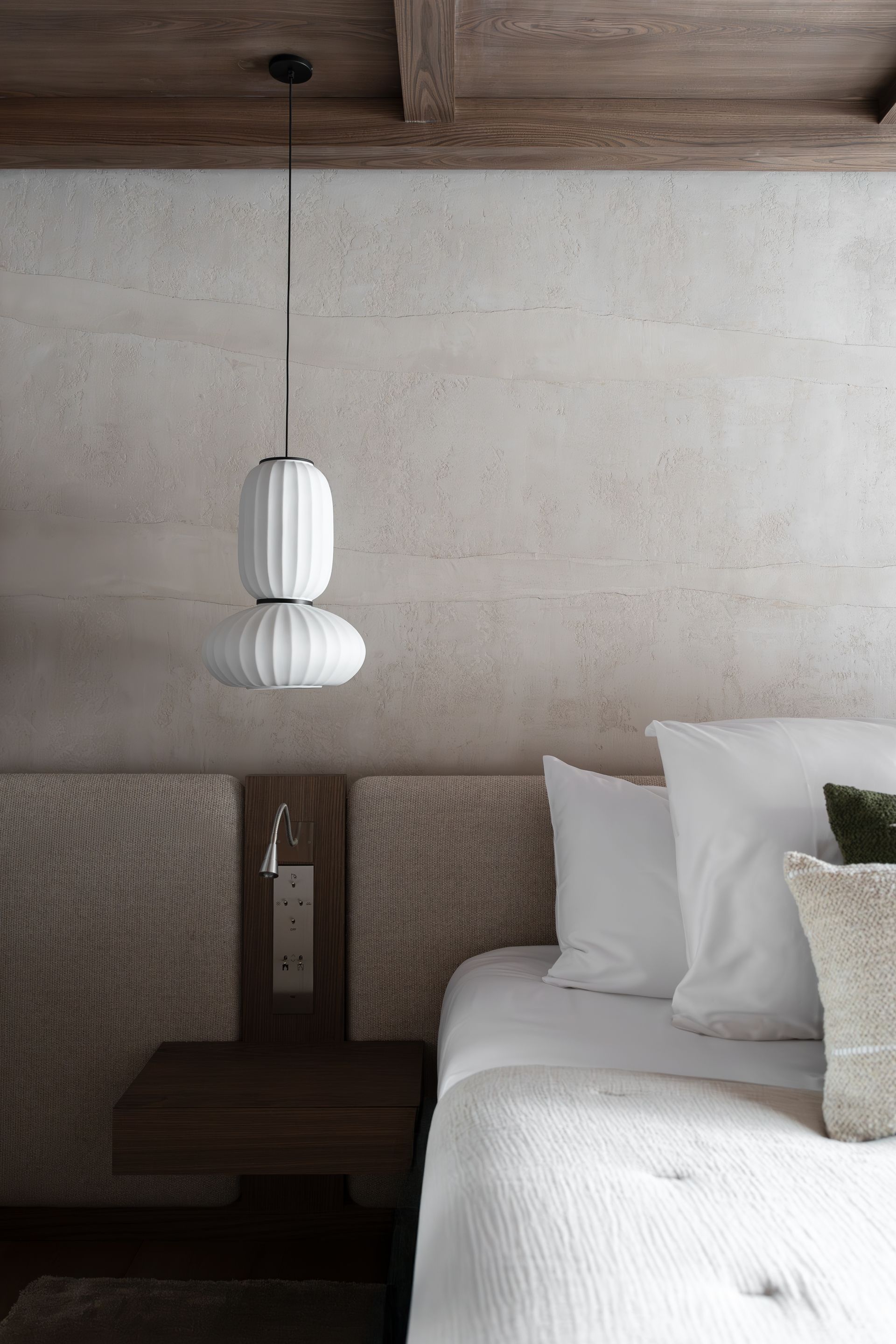 Chalet Escapade A bedroom with a bed , nightstand , and pendant light.