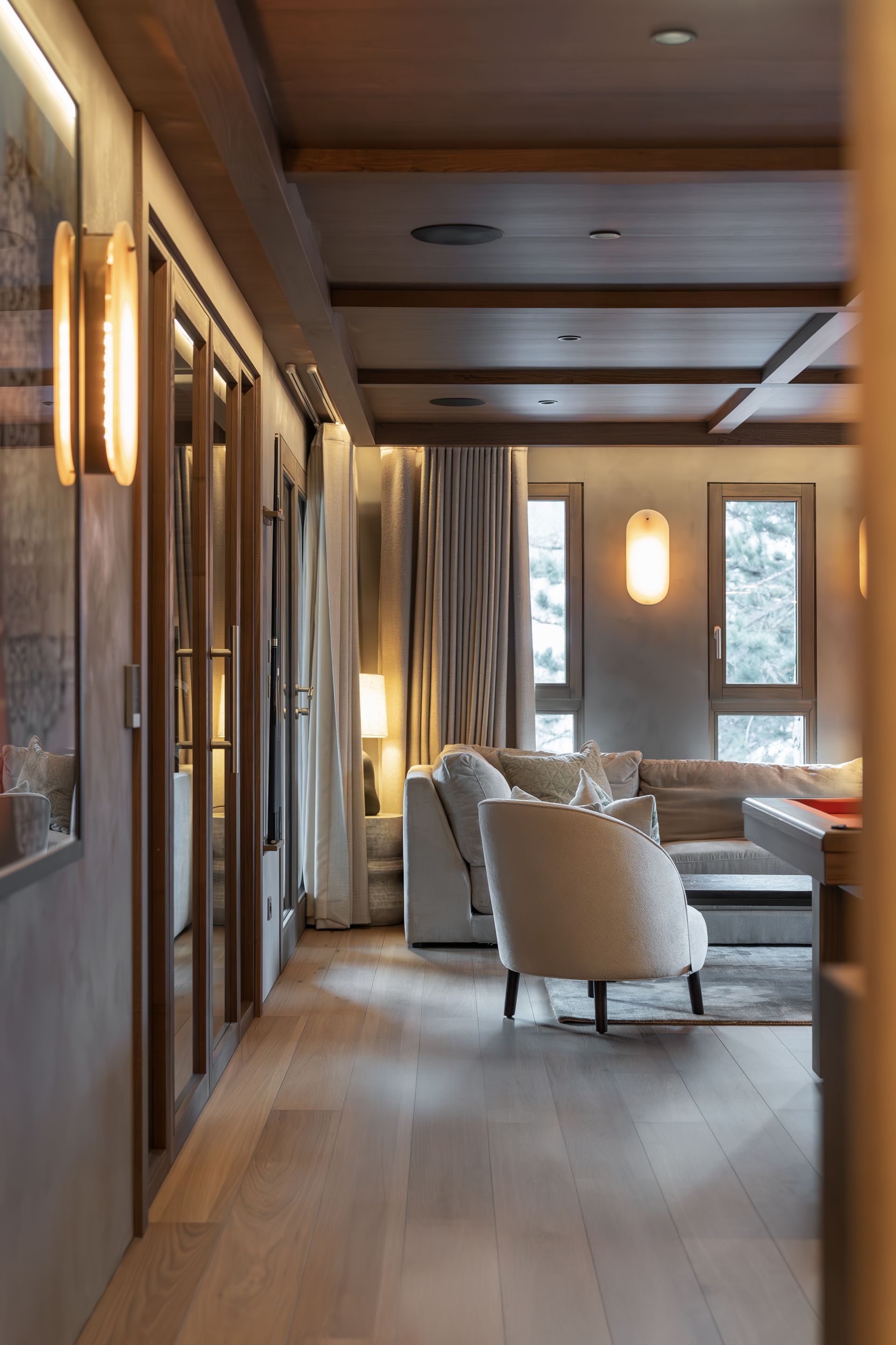 Chalet Escapade A living room with a couch and chairs in it