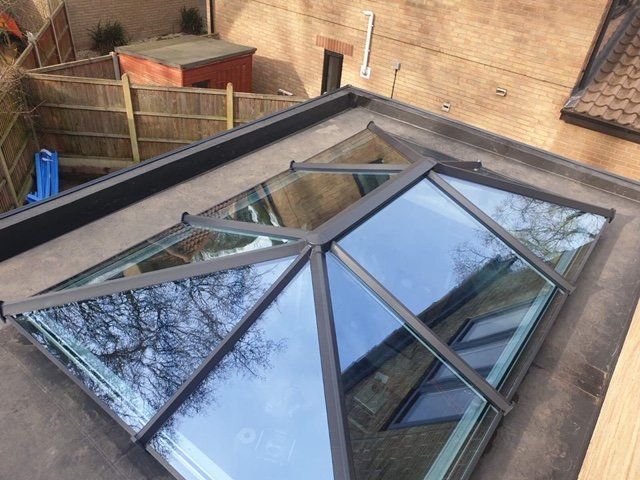 an aerial view of a skylight on the roof of a house