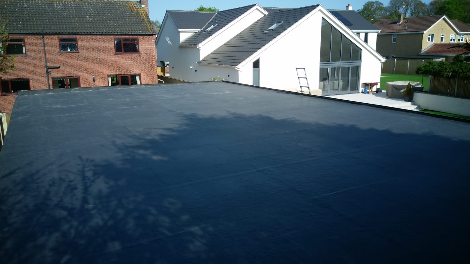 a large white house with a black roof