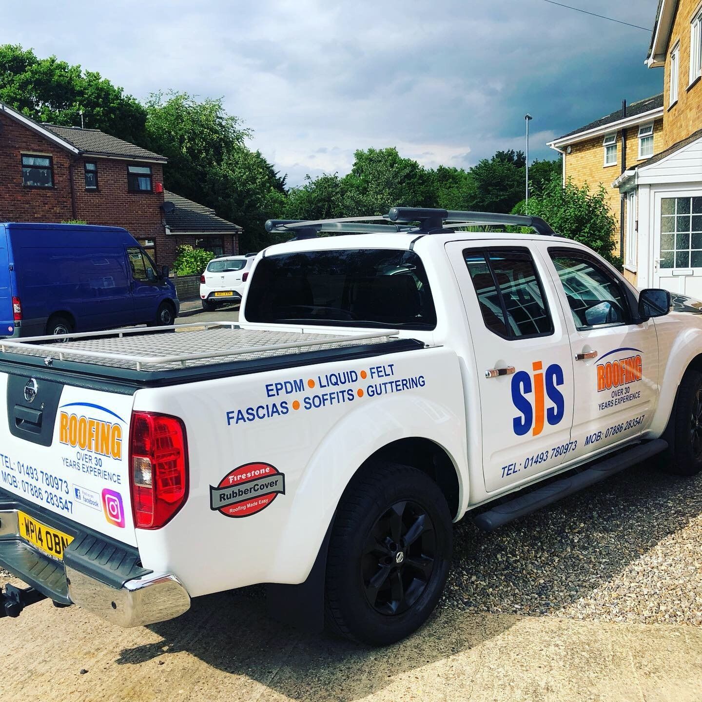 a white truck with the word roofing on it