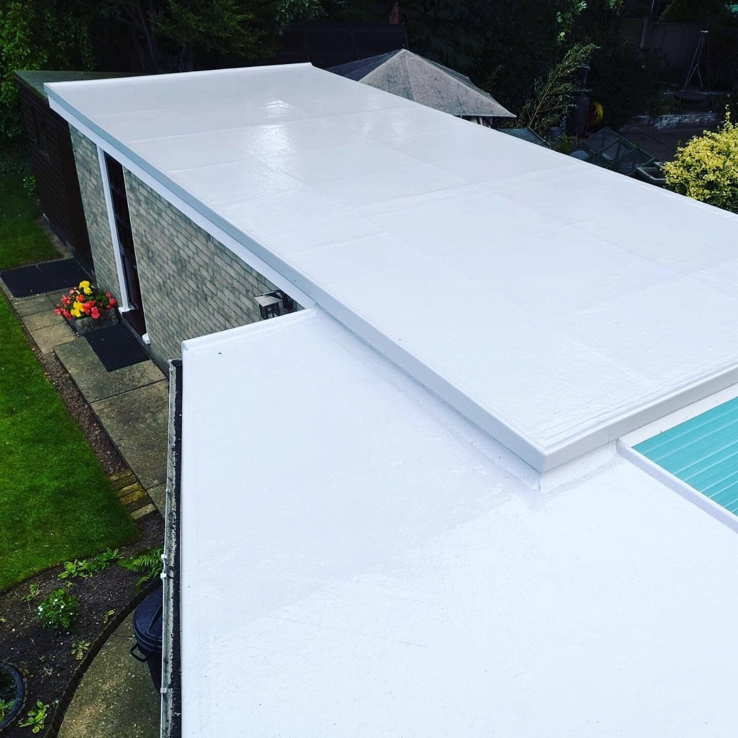 a white roof with a blue sky in the background