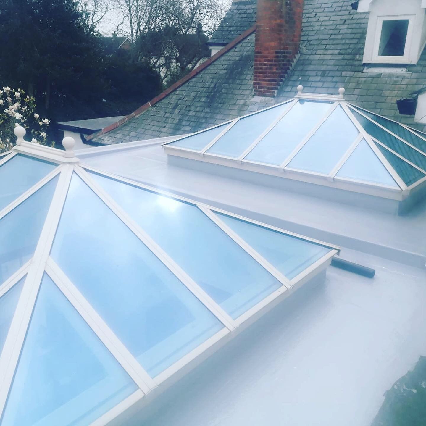 two skylights on the roof of a house