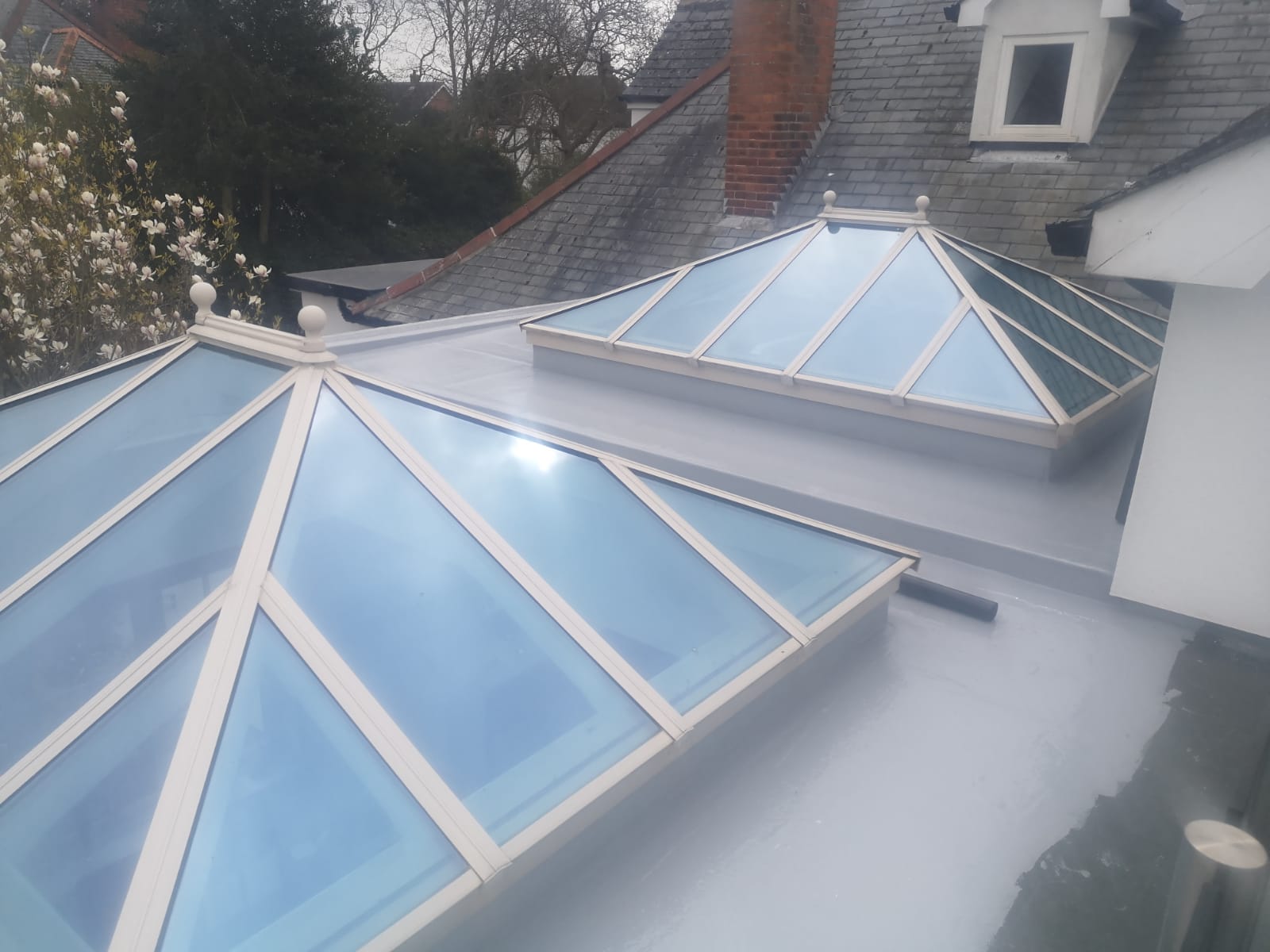 two skylights on the roof of a building