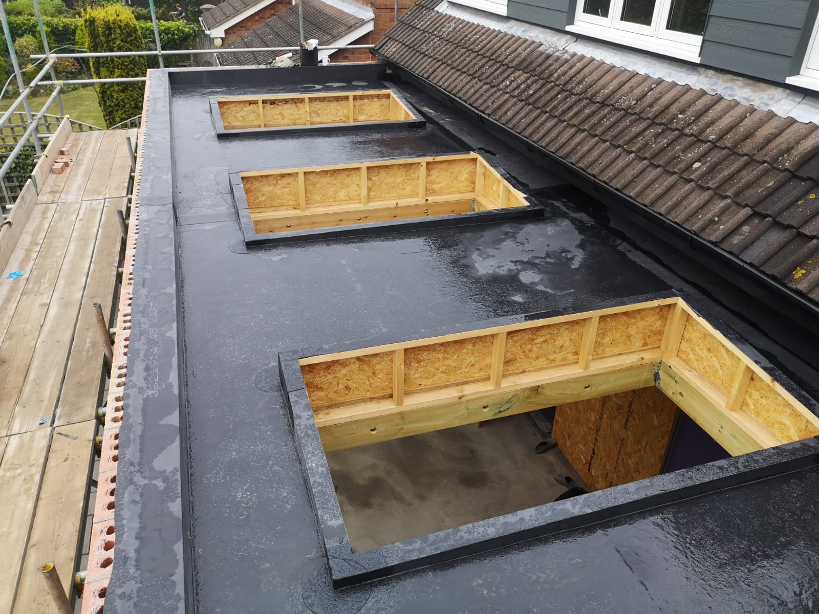 a roof with a few skylights on it