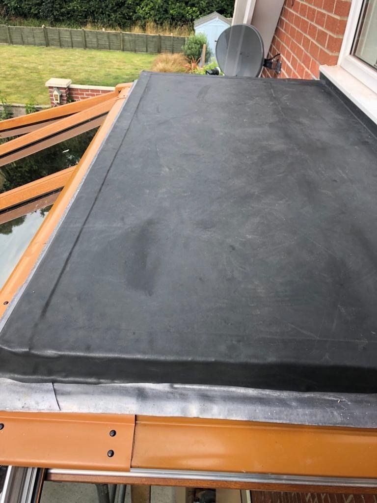 a black roof with a satellite dish on top of it