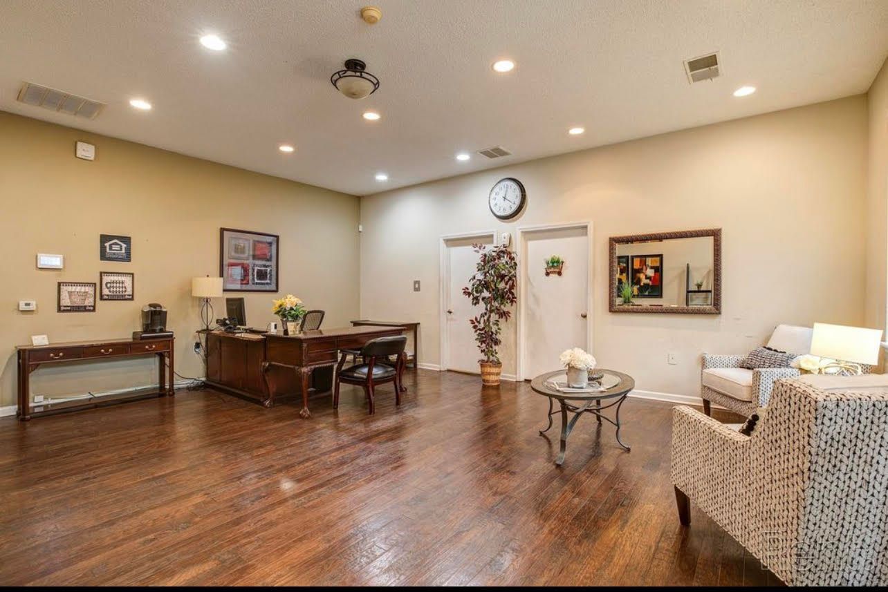 There is a clock on the wall in the middle of the room.