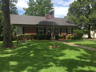A house with an american flag in front of it