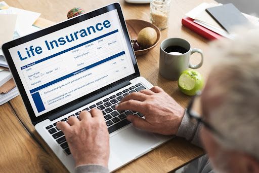 Older man researching what life insurance covers.