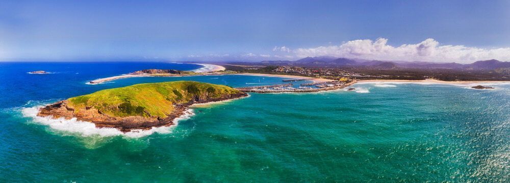 An Aerial View of A Small Island in The Middle of The Ocean — Custom Cabinetry & Kitchen Renovations in Coffs Harbour, NSW