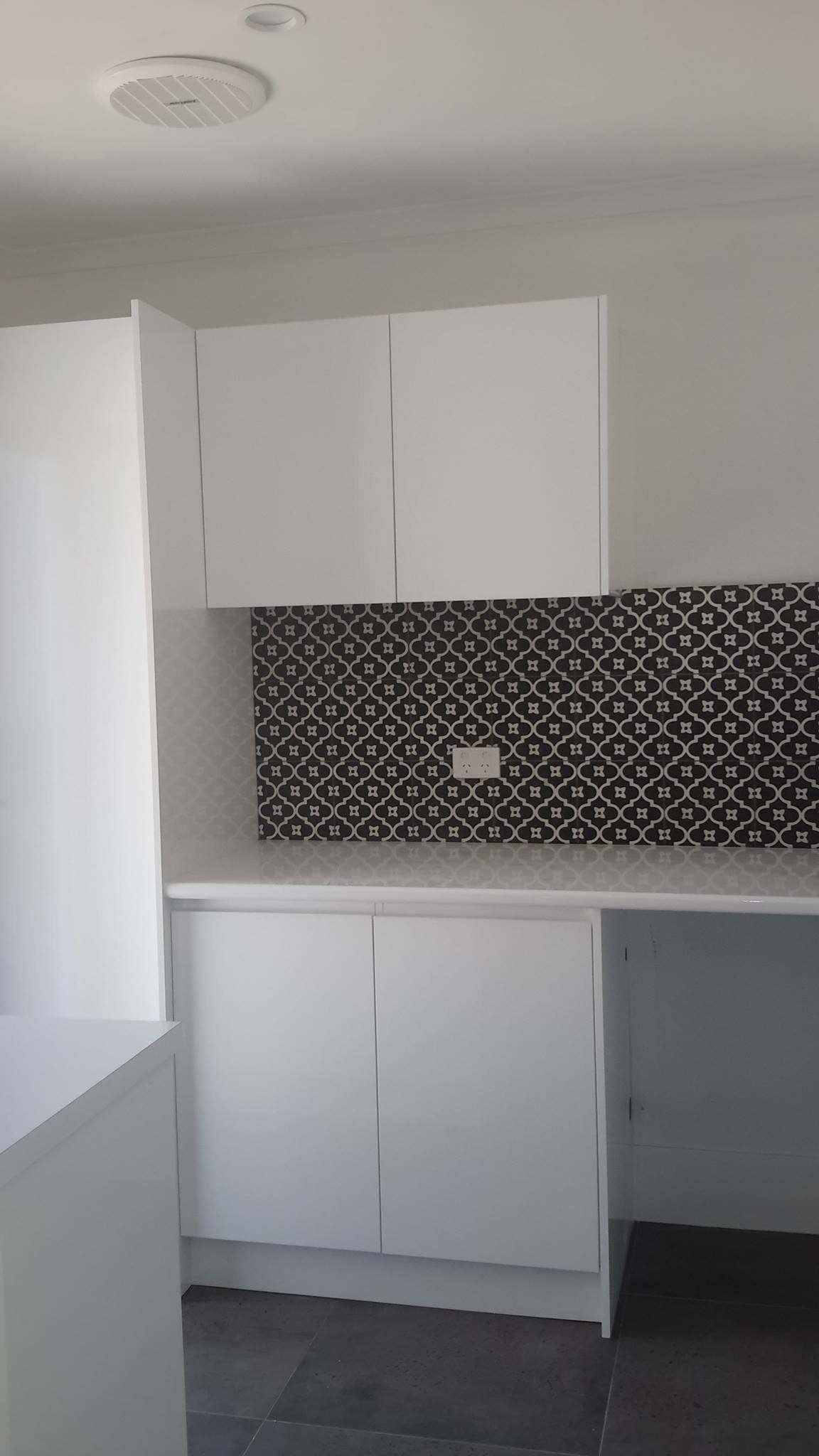 White Cabinets and Decorative Tiles — Custom Cabinetry & Kitchen Renovations in Nambucca Heads, NSW