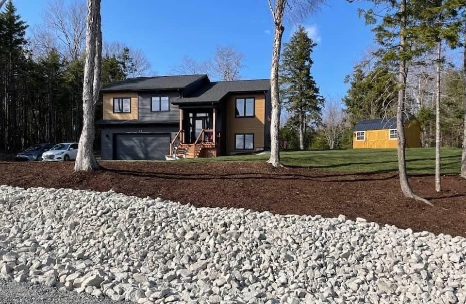 a yellow snow plow is clearing snow from a parking lot
