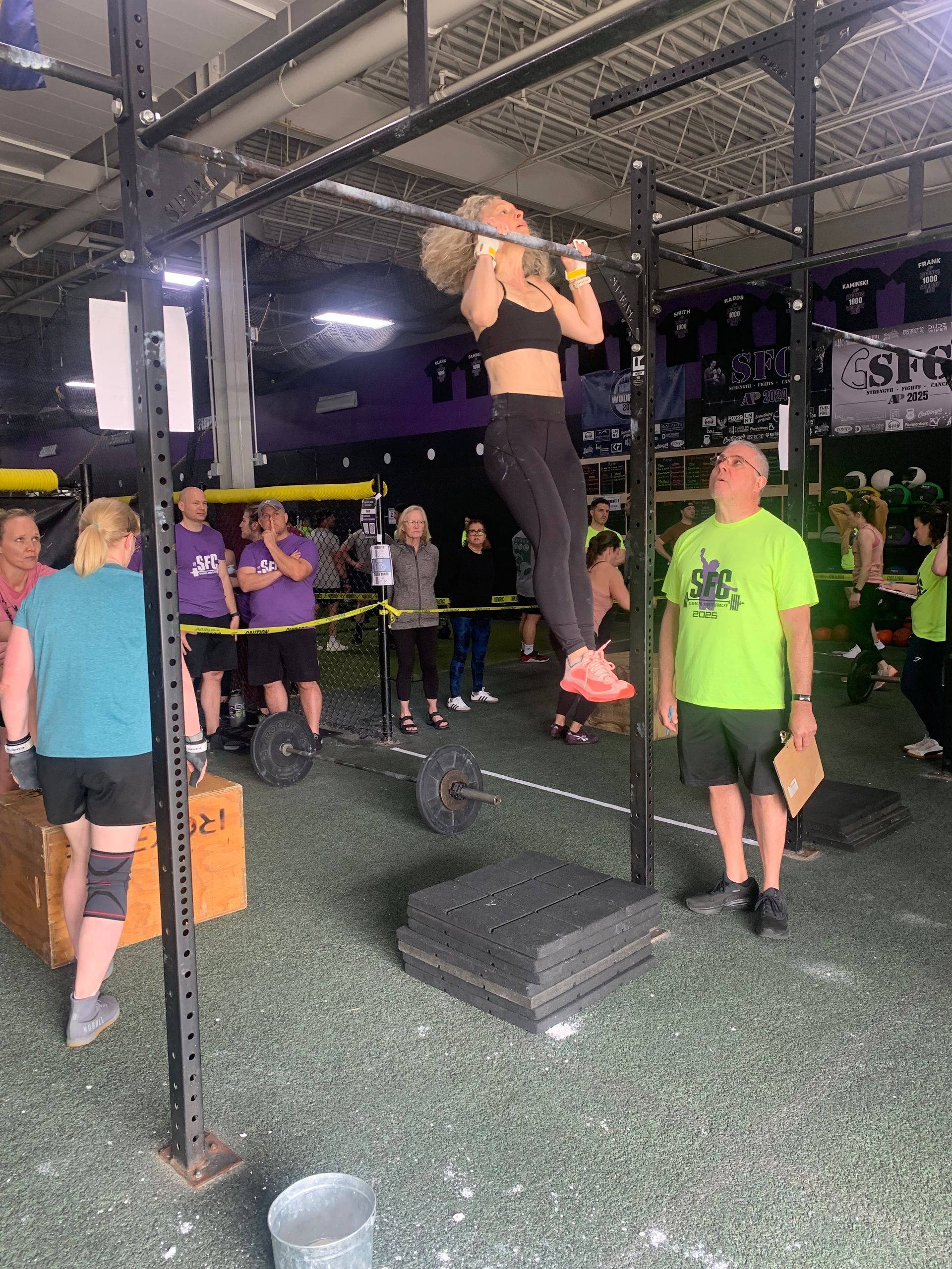 Beginner athlete competing for first time with teammates and family cheering in crowd