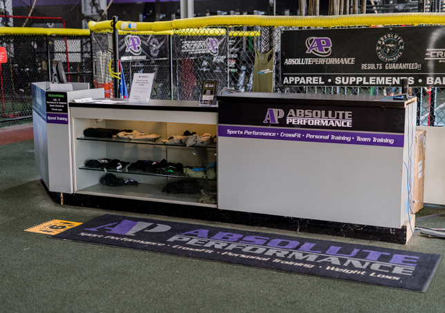 An absolute performance store with a counter and display case