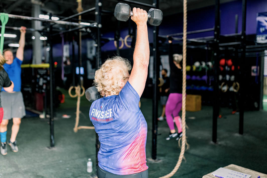 Active 55+ athletes training together, showing strength and confidence in group fitness class